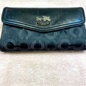Black Coach wallet with check book that is removable.